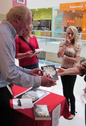 Keith Bulfin signing books for readers