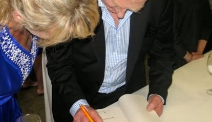 Keith Bulfin signing a book