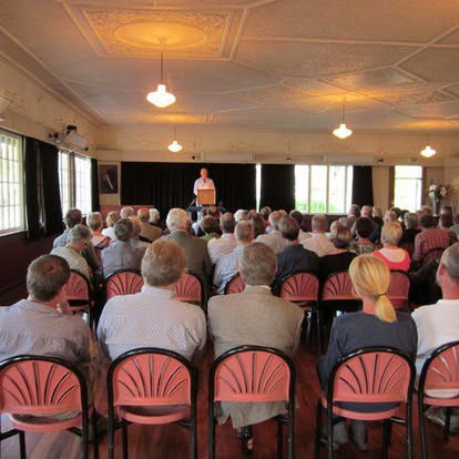 An audience at a talk by Keith Bulfin